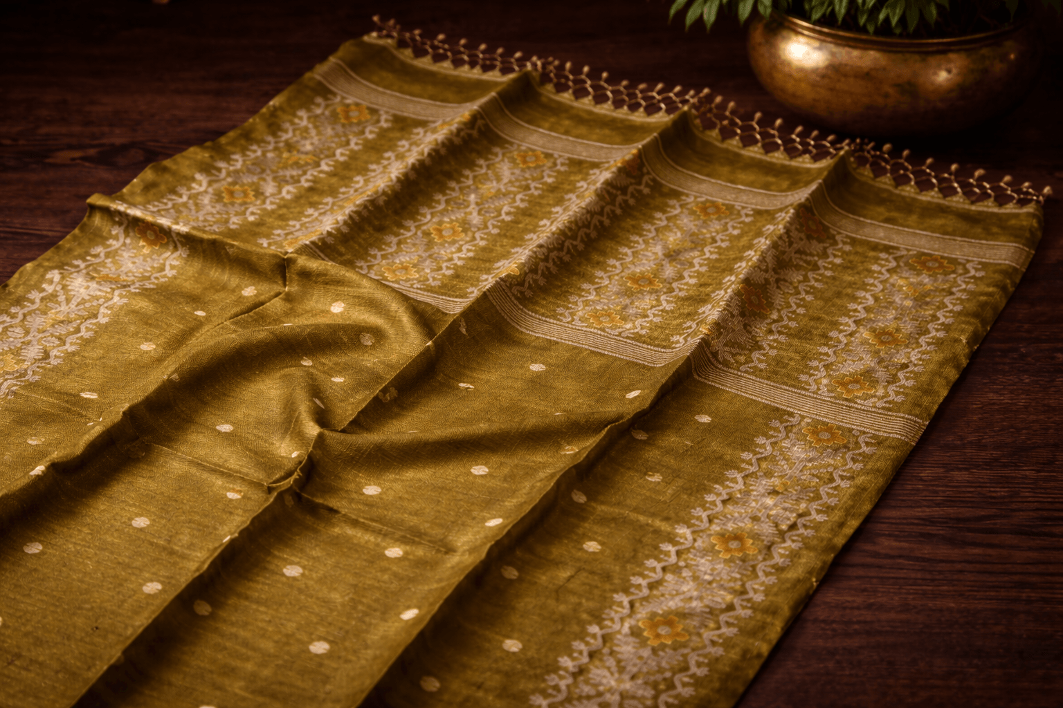 A Bengal Tussar Jamdani saree with intricate golden Jamdani motifs on earthy Tussar silk